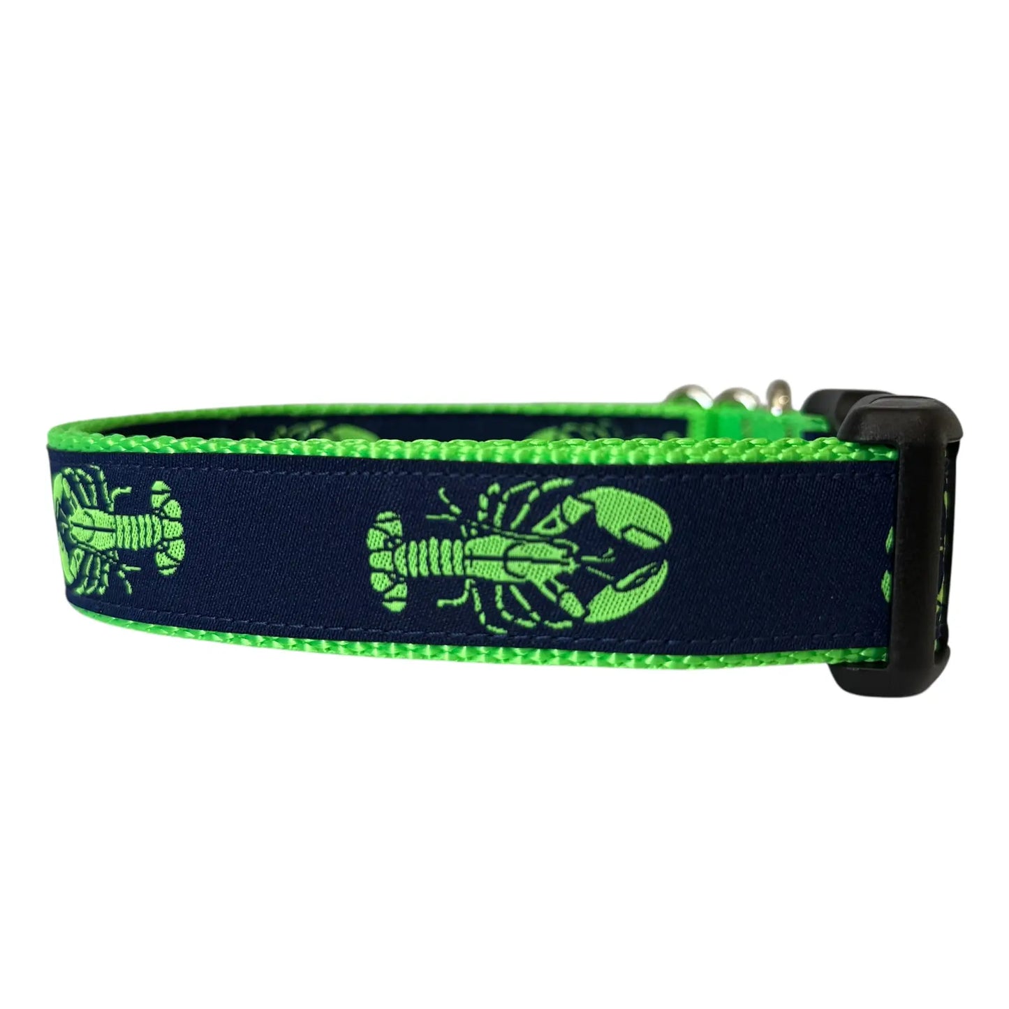 Adjustable nylon webbing dog collar featuring a repeating lime green lobster pattern stitched onto a navy blue ribbon background, bordered by bright lime green webbing with a black plastic buckle.