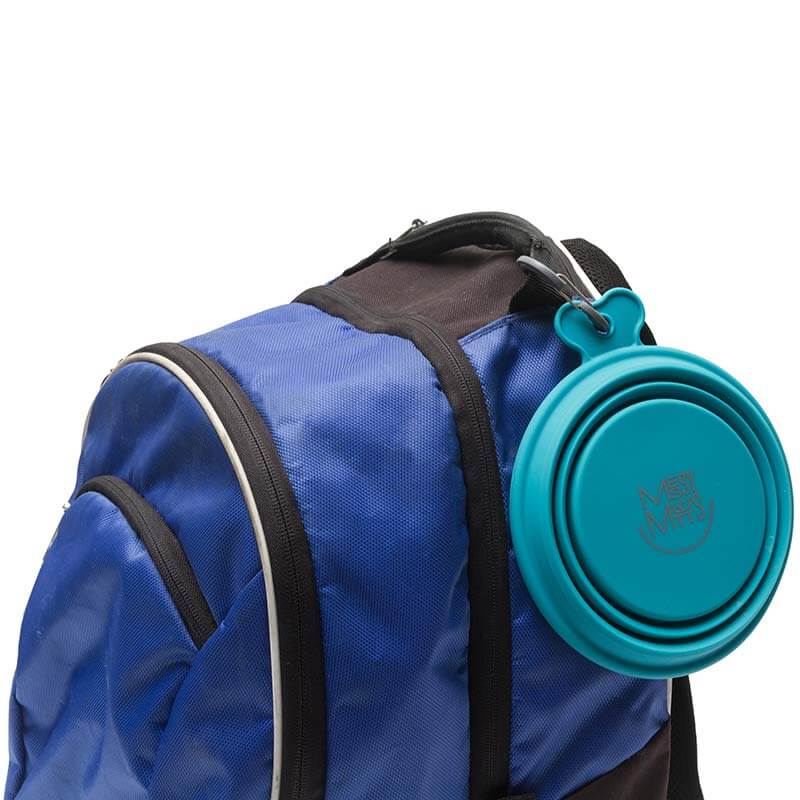Blue backpack with a teal collapsible cup attached on a white background