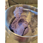 Rich, purple-hued dough being mixed in a stainless steel bowl, showcasing the authentic, small-batch handmade process. Thumbnail
