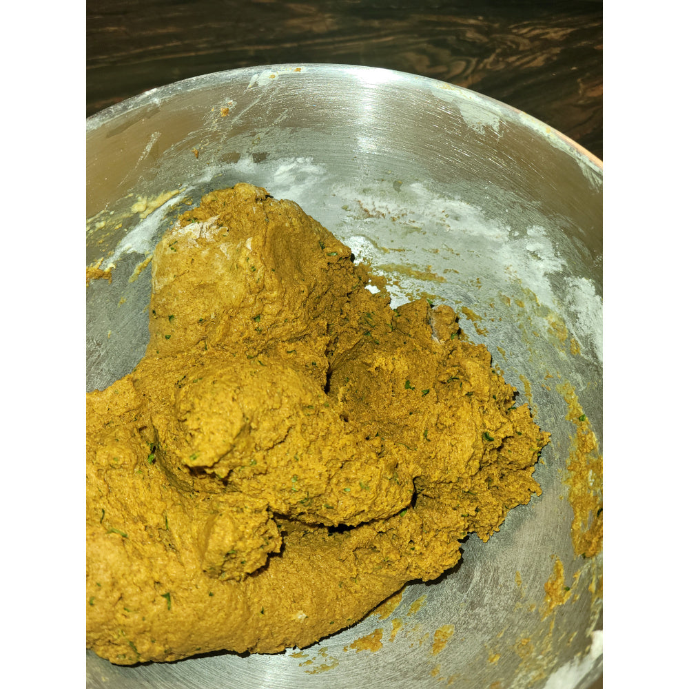 Freshly mixed, golden treat dough resting in a bowl, emphasizing the authentic, handmade preparation process.