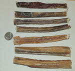 Seven 6-inch odorless bully sticks laid flat with quarter coin for size reference.  Thumbnail