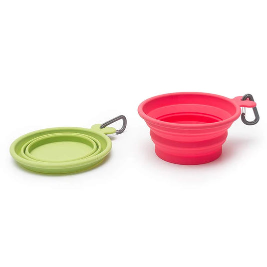 Green and pink collapsible silicone pet bowls on a white background