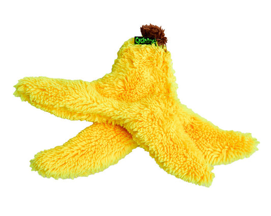 banana shaped plush dog toy on white background