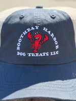 Close-up of the navy and white Boothbay Harbor Dog Treats trucker hat with embroidered red lobster logo and mesh back Thumbnail