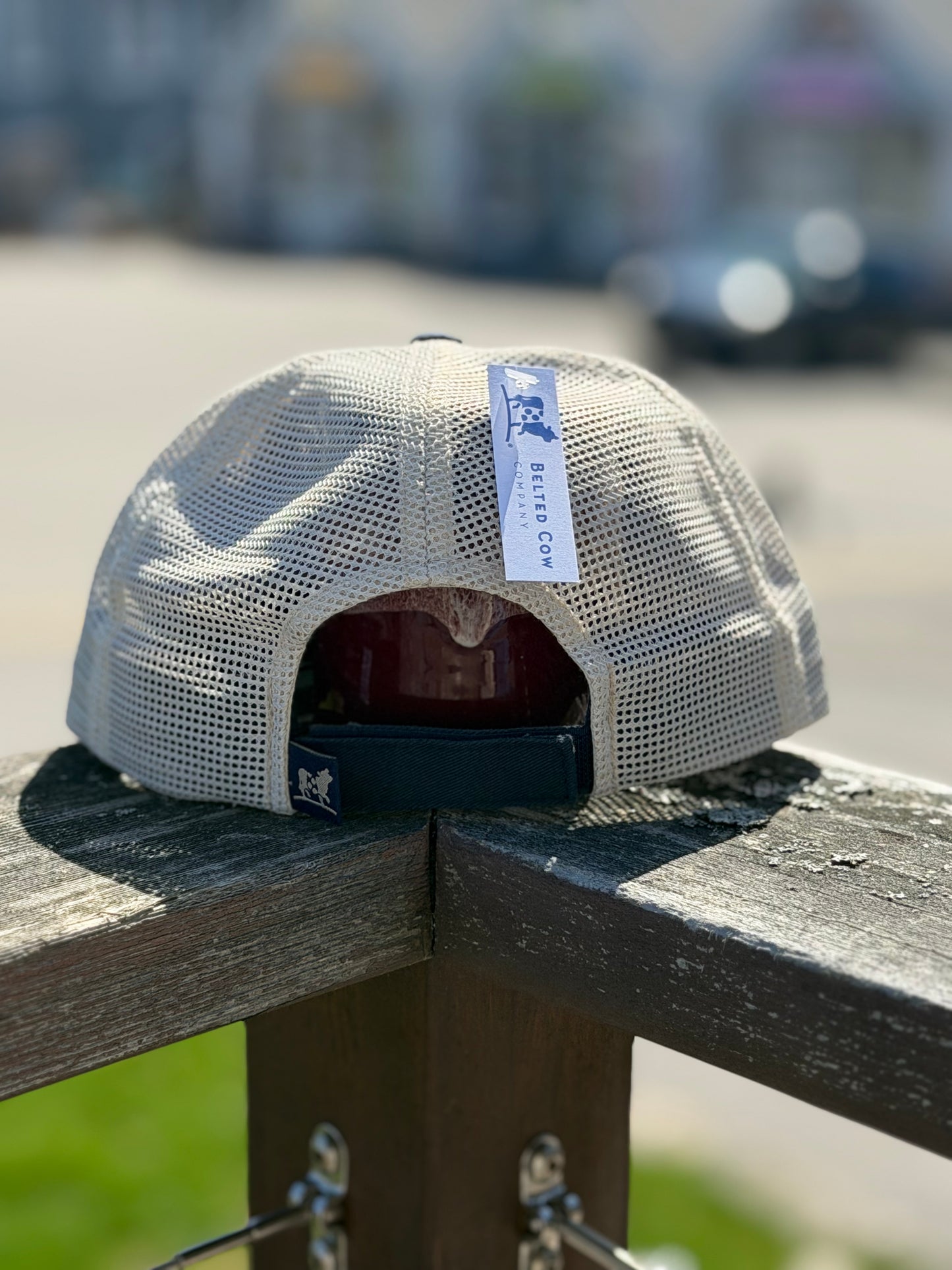 Meshed Back of the Navy and white Boothbay Harbor Dog Treats trucker hat.