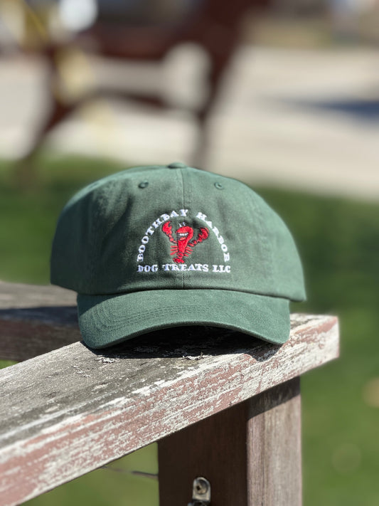 Forest green Boothbay Harbor Dog Treats dad hat with embroidered red lobster logo
