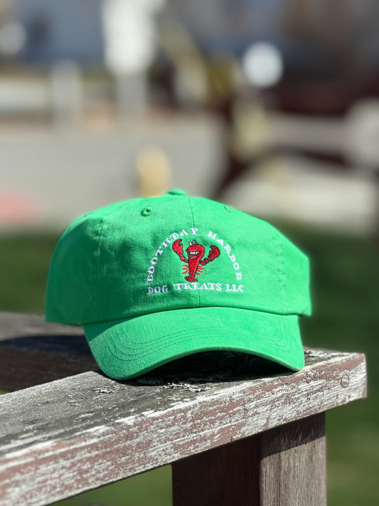 Kelly green Boothbay Harbor Dog Treats dad hat with embroidered red lobster logo.