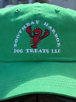Close up of Kelly green Boothbay Harbor Dog Treats dad hat with embroidered red lobster logo Thumbnail
