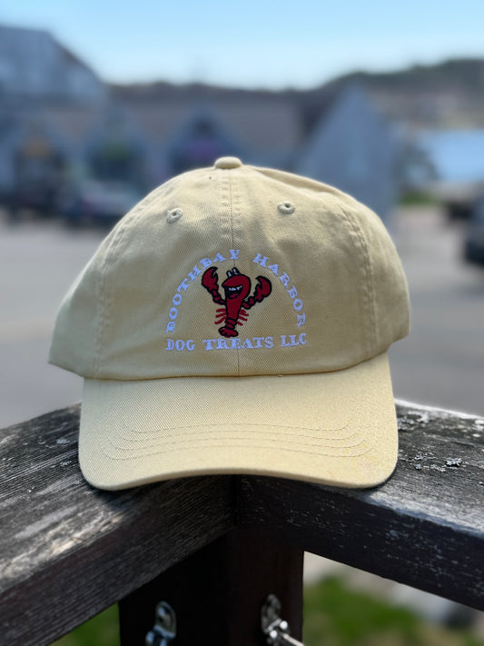 Khaki Boothbay Harbor Dog Treats dad hat with embroidered red lobster logo.