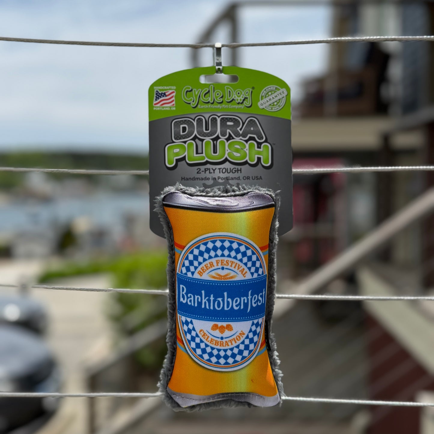 Dura Plush toy shaped like a beer can with 'Barktoberfest' branding.