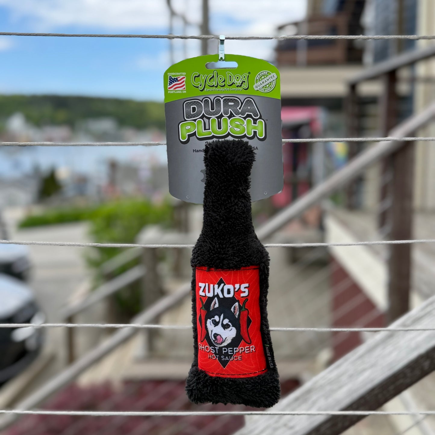 Zuko's Ghost Pepper Hot Sauce plush toy hanging on a wire