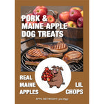 Front packaging label for Pork & Maine Apple Dog Treats featuring a cartoon pig holding apples, alongside graphics of real apples and grilled pork chops, noting an approximate net weight of 3oz (85g). Thumbnail