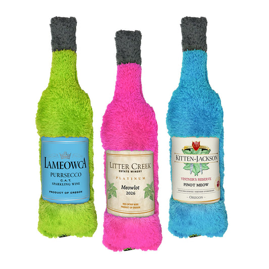 Three colorful wine bottle-shaped catnip toys with labels on a white background