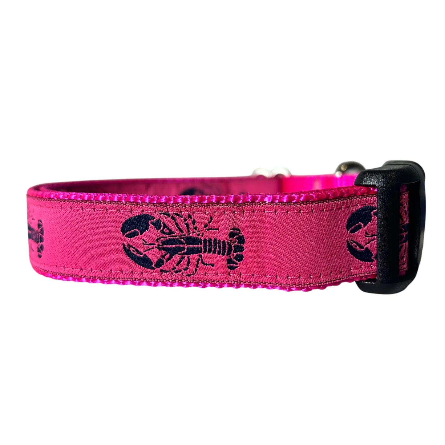 Adjustable nylon webbing dog collar featuring a repeating navy blue lobster pattern on a hot pink ribbon background, attached to vibrant pink webbing with a black plastic buckle.