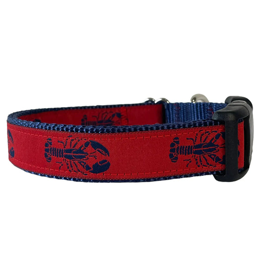 Red dog collar with navy blue lobsters on a white background.