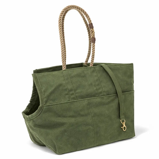 Green dog carrier with rope handles and brass hardware